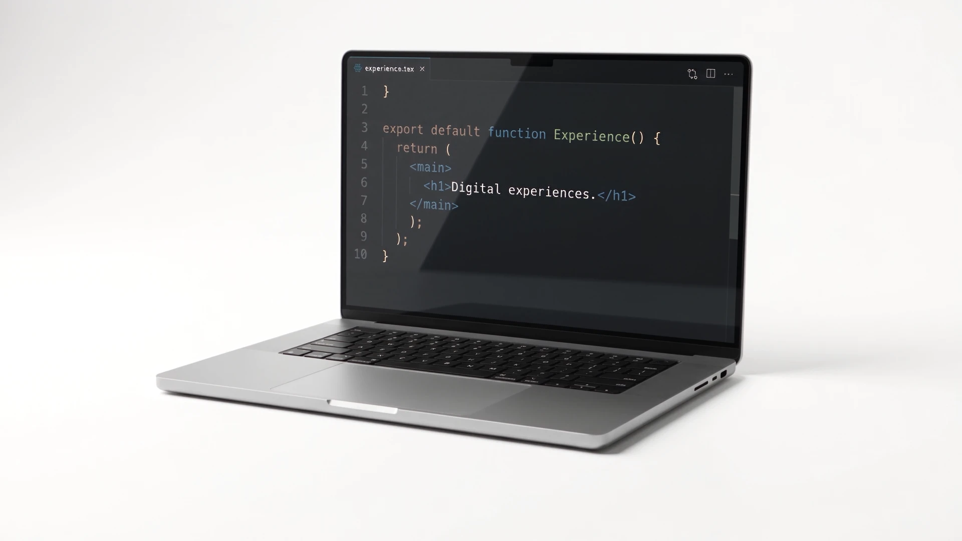A silver laptop displaying website code in a white studio.